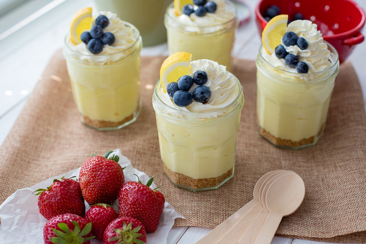 https://www.nourish-and-fete.com/wp-content/uploads/2018/07/lemon-cheesecake-mousse-parfaits-facebook.jpg