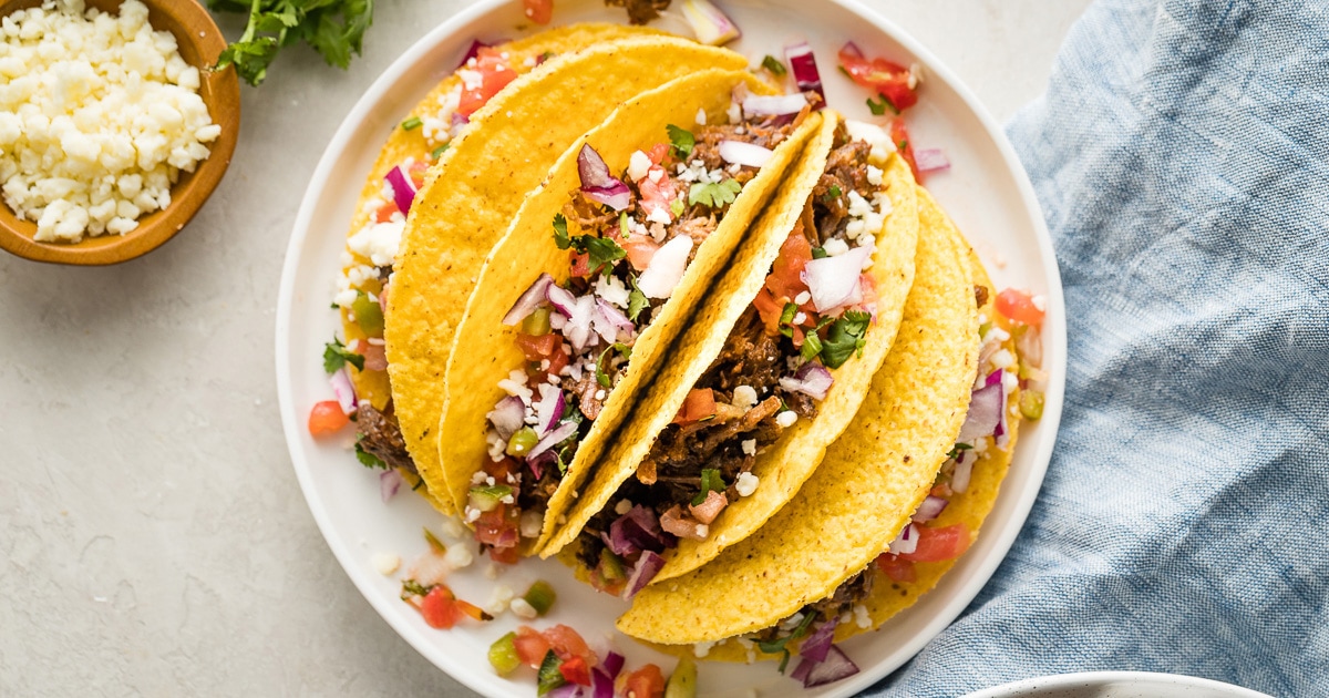 INCREDIBLE Slow Cooker Barbacoa - like Chipotle at home! - Nourish and Fete