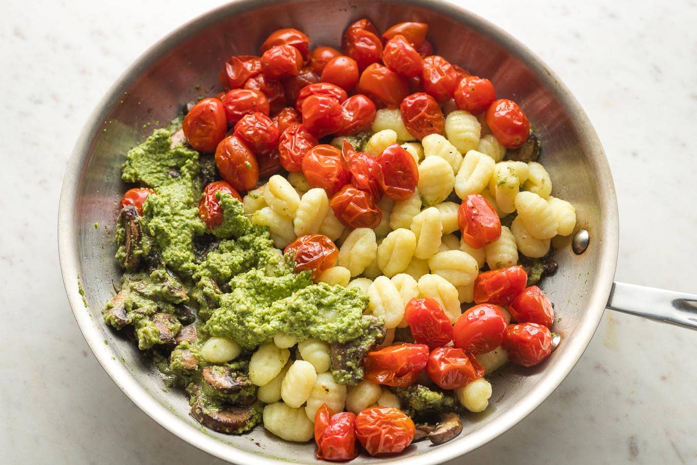 Gnocchi With Pesto And Charred Cherry Tomatoes - Nourish And Fete