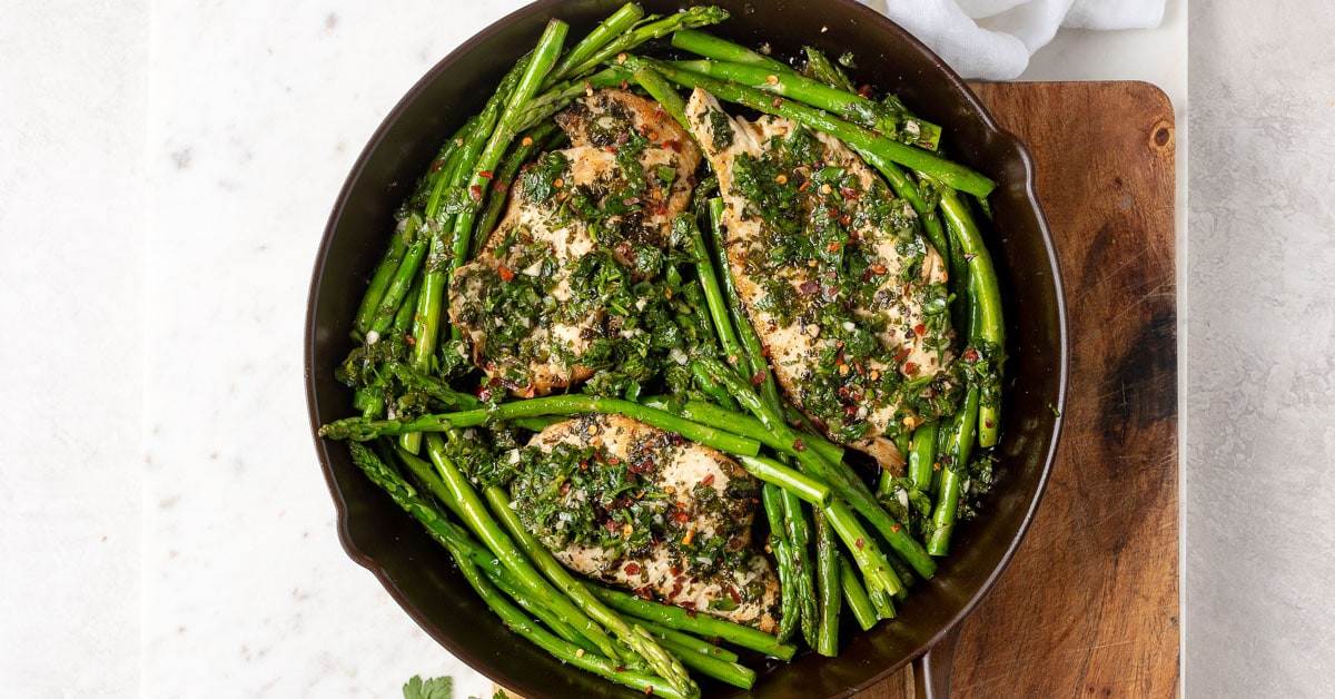 https://www.nourish-and-fete.com/wp-content/uploads/2019/02/chimichurri-chicken-asparagus-skillet-facebook.jpg