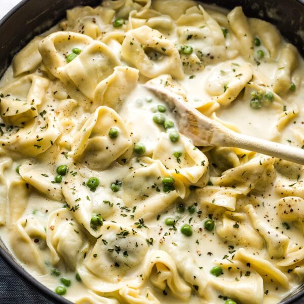 Creamy Tortellini Alfredo with Peas - Nourish and Fete