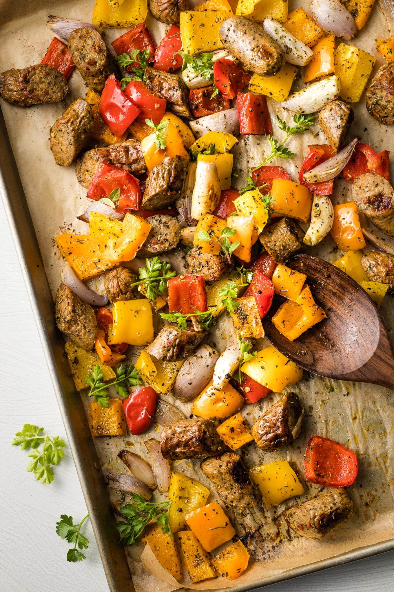 https://www.nourish-and-fete.com/wp-content/uploads/2021/04/sheet-pan-chicken-sausage-peppers-6.jpg