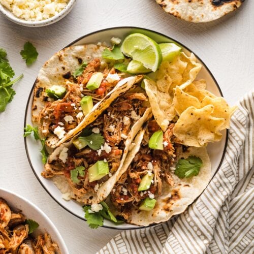 https://www.nourish-and-fete.com/wp-content/uploads/2021/11/crockpot-shredded-chicken-tacos-3-500x500.jpg